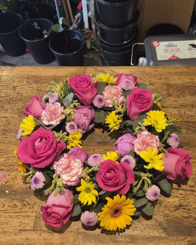 Mixed Wreath - A beautiful open wreath in bright, cheerful shades, symbolising love, remembrance and treasured memories.