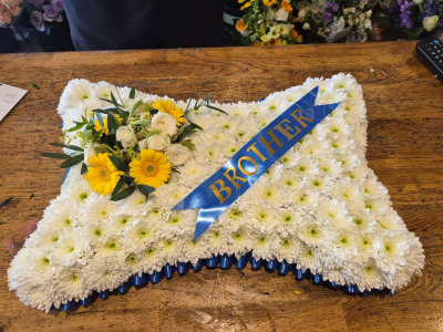 Pillow - A traditional pillow tribute, lovingly designed as a meaningful expression of remembrance and respect.
