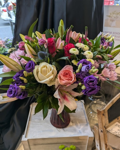 Scent with love - Scented lilies surrounded by seasonal flowers  delivered in a glass vase