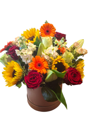 Golden Glow Hatbox - A vibrant hatbox arrangement in rich red, orange and golden yellow tones, creating a bold and cheerful display.