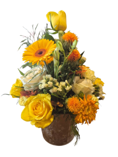 Yellow Glow - A warm and uplifting arrangement in vibrant yellow, orange and cream tones, beautifully presented with fresh greenery.
