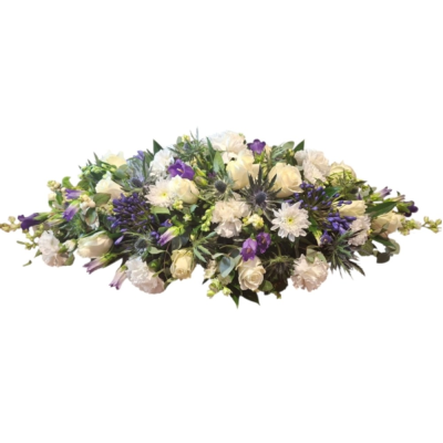 Highland Grace - An elegant casket spray in crisp whites, rich purples and cool blue tones, finished with fresh greenery.