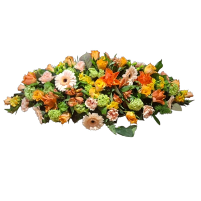 Golden Memories Spray - A warm and elegant casket spray in soft peach, orange and golden tones, thoughtfully arranged with fresh greenery for a beautiful farewell. 3ft