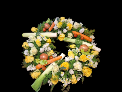 Gardener’s Wreath - A unique funeral wreath combining fresh flowers, greenery and garden vegetables for a personal tribute to someone who loved gardening.