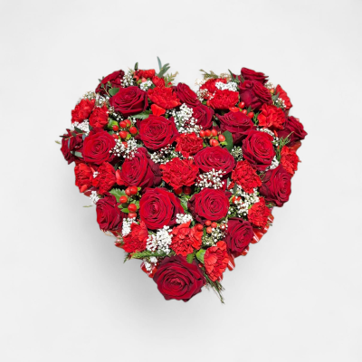 Everlasting Love Funeral Heart - A striking heart-shaped funeral tribute filled with rich red flowers and delicate white accents, creating a beautiful expression of love and affection.