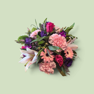 Pink & Purple Funeral Posy - A beautiful funeral posy featuring soft pink and rich purple flowers with fresh greenery, creating a colourful and heartfelt tribute.