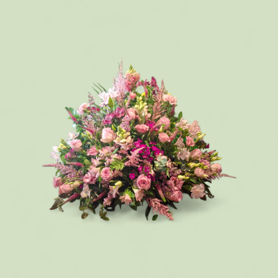 Pink Grace Funeral Spray - A beautiful funeral spray featuring soft pink and rich cerise flowers with fresh greenery, creating an elegant and heartfelt tribute.