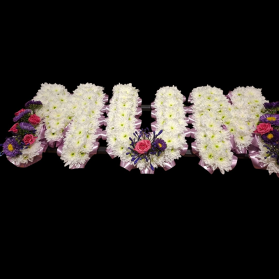 Personalised Funeral Letter Tribute - Personalised funeral lettering created with fresh white flowers, finished with pink and purple floral sprays and coordinating ribbon.
